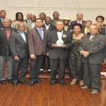 Colonel Cecil “Pluto” Martindale (centre), with gift, poses with members of the Guyana Ex-Soldiers of Canada (Photo Credit Guyana Chronicle)